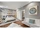 Stylish bedroom featuring a comfortable seating area, modern decor, and an en-suite bathroom at 2565 Champa St, Denver, CO 80205