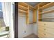 Well-organized closet with custom shelving, drawers, and natural light at 2565 Champa St, Denver, CO 80205