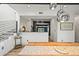 Bright dining room features hardwood floors and a modern chandelier at 2565 Champa St, Denver, CO 80205