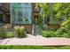 Modern home with striking architectural details, green landscaping, and a welcoming entrance at 2565 Champa St, Denver, CO 80205