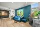 Stylish living room with contemporary furnishings, wood floors, and natural light at 2565 Champa St, Denver, CO 80205