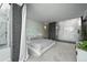 Spacious main bedroom with neutral colors, large windows, and a modern design at 2565 Champa St, Denver, CO 80205