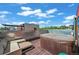 Relaxing rooftop deck featuring a hot tub, lounge seating, and pergola offering a private outdoor space at 2565 Champa St, Denver, CO 80205