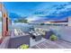 Inviting rooftop patio with cozy outdoor seating, offering views of a stunning colorful sky at 2565 Champa St, Denver, CO 80205