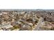 Aerial view of a neighborhood showing streets, houses, and trees against a skyline at 7140 Avrum Dr, Denver, CO 80221