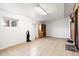 Finished basement area with tiled flooring, offering versatile space at 7140 Avrum Dr, Denver, CO 80221