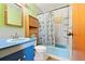 Vintage style bathroom featuring bright fixtures and a shower-tub combination at 7140 Avrum Dr, Denver, CO 80221