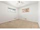 Clean and bright bedroom with neutral carpet and good natural light at 7140 Avrum Dr, Denver, CO 80221