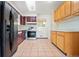 Functional kitchen layout with essential appliances and ample cabinet space at 7140 Avrum Dr, Denver, CO 80221