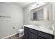 Well-lit bathroom featuring a vanity, a modern toilet, and a framed mirror at 23405 E 5Th Pl # 201, Aurora, CO 80018