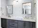 Modern bathroom featuring dual sinks, quartz countertops, and gray cabinetry at 23405 E 5Th Pl # 201, Aurora, CO 80018