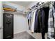 Organized walk-in closet with shelving, hanging racks, and safe at 23405 E 5Th Pl # 201, Aurora, CO 80018