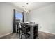 Cozy dining area featuring a modern light fixture and a window, creating an inviting space for meals at 23405 E 5Th Pl # 201, Aurora, CO 80018