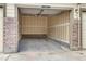 Interior view of an empty garage with painted walls and a concrete floor at 23405 E 5Th Pl # 201, Aurora, CO 80018