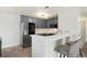 Bright kitchen features stainless steel appliances and bar seating at 23405 E 5Th Pl # 201, Aurora, CO 80018