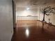 Expansive basement featuring hardwood floors, a tree mural and bright recessed lighting at 812 S Ouray St, Aurora, CO 80017