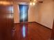 Cozy bedroom with hardwood floors, ceiling fan, and a window dressed in a curtain at 812 S Ouray St, Aurora, CO 80017