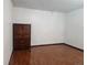Bedroom with hardwood floors and a classic wood armoire and two wall plugs at 812 S Ouray St, Aurora, CO 80017