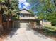 Charming two-story home with attached two car garage and brick and siding exterior in a mature neighborhood at 812 S Ouray St, Aurora, CO 80017