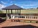 Gazebo with seating on a wooden deck overlooking a grassy field at 812 S Ouray St, Aurora, CO 80017