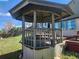 Outdoor gazebo with decorative woodwork, deck, and a view of the backyard at 812 S Ouray St, Aurora, CO 80017