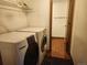 Functional laundry room with appliances and storage shelf with easy access to the rest of the home at 812 S Ouray St, Aurora, CO 80017