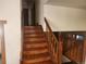 Beautiful wooden stairway and railing leading to the second floor of the home at 812 S Ouray St, Aurora, CO 80017