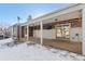 Covered patio with brick walls and string lights, perfect for outdoor entertaining at 14059 W 5Th Ave, Golden, CO 80401