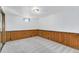 Basement bedroom with wood paneling and carpeted floors at 14059 W 5Th Ave, Golden, CO 80401