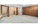 Spacious basement with wood-paneled walls and carpeted floors at 14059 W 5Th Ave, Golden, CO 80401