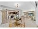 Open concept dining area with a glass table and kitchen views at 14059 W 5Th Ave, Golden, CO 80401