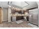 Modern kitchen features stainless steel appliances and dark wood cabinets at 14059 W 5Th Ave, Golden, CO 80401