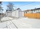 Small backyard with gravel, wooden fence, and shed at 3500 N Marion St, Denver, CO 80205