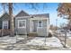 Newly renovated gray house with a white porch and fenced yard at 3500 N Marion St, Denver, CO 80205