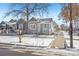 Newly remodeled gray house with white trim and a snow-covered yard at 3500 N Marion St, Denver, CO 80205