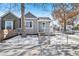 Updated bungalow with gray exterior, white porch, and chain link fence at 3500 N Marion St, Denver, CO 80205