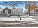 Renovated gray house with a white porch, snow on the ground at 3500 N Marion St, Denver, CO 80205