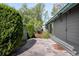 Private backyard patio with stone pavers, lush greenery, and a tranquil setting for outdoor enjoyment at 8080 E Dartmouth Ave # 26, Denver, CO 80231