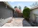 Enclosed patio featuring stone pavers, privacy wall, and colorful trees at 8080 E Dartmouth Ave # 26, Denver, CO 80231