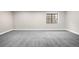 Spacious bedroom with neutral walls, white trim, and carpet flooring, offering ample natural light at 8080 E Dartmouth Ave # 26, Denver, CO 80231