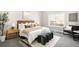 Cozy bedroom with accent rug, bedside tables, and large window at 8080 E Dartmouth Ave # 26, Denver, CO 80231