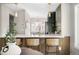 Bright kitchen with breakfast bar, white countertops, and modern, olive-colored cabinets at 8080 E Dartmouth Ave # 26, Denver, CO 80231