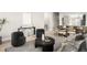 Stylish living room featuring modern decor, open space, and view into the dining area at 8080 E Dartmouth Ave # 26, Denver, CO 80231