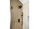 Modern shower featuring wood wall accent, sleek fixtures, and textured tile, creating a spa-like experience at 8080 E Dartmouth Ave # 26, Denver, CO 80231