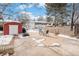 Backyard view with shed, some snow on ground at 12008 W Mexico Pl, Lakewood, CO 80228