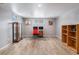 Finished basement with office and built-in shelving at 12008 W Mexico Pl, Lakewood, CO 80228