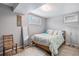 Basement bedroom with wood-framed bed and mirror at 12008 W Mexico Pl, Lakewood, CO 80228