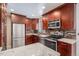 Bright kitchen, stainless steel appliances, granite countertops at 12008 W Mexico Pl, Lakewood, CO 80228