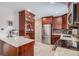 Granite countertops and stainless steel appliances in this kitchen at 12008 W Mexico Pl, Lakewood, CO 80228