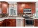 Kitchen boasts granite countertops and stainless steel appliances at 12008 W Mexico Pl, Lakewood, CO 80228